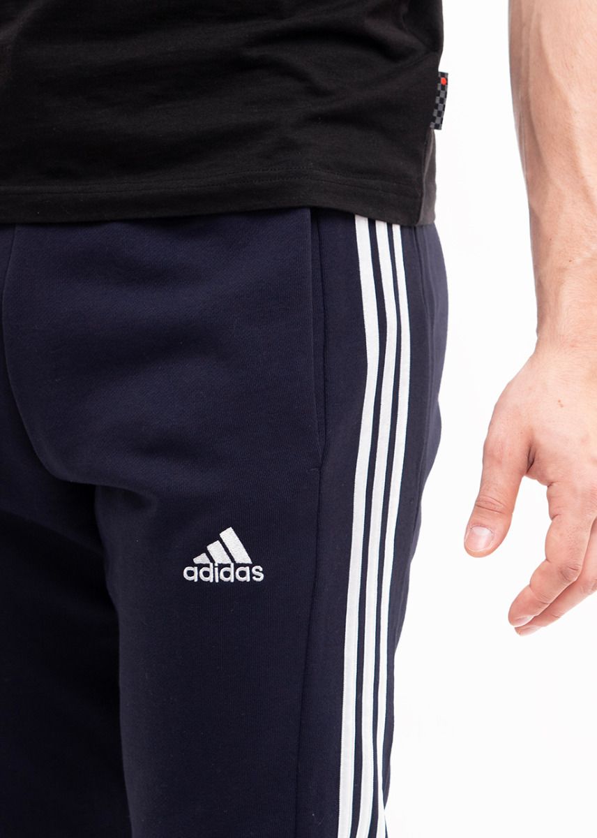 adidas Spodnie męskie Essentials French Terry Tapered Cuff 3-Stripes IC9406