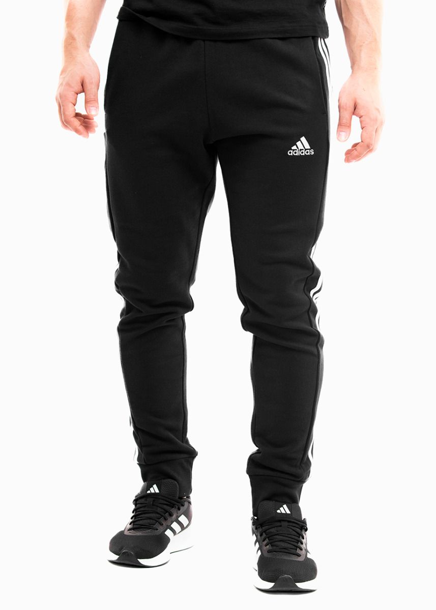 adidas Spodnie męskie Essentials French Terry Tapered Cuff 3-Stripes HA4337