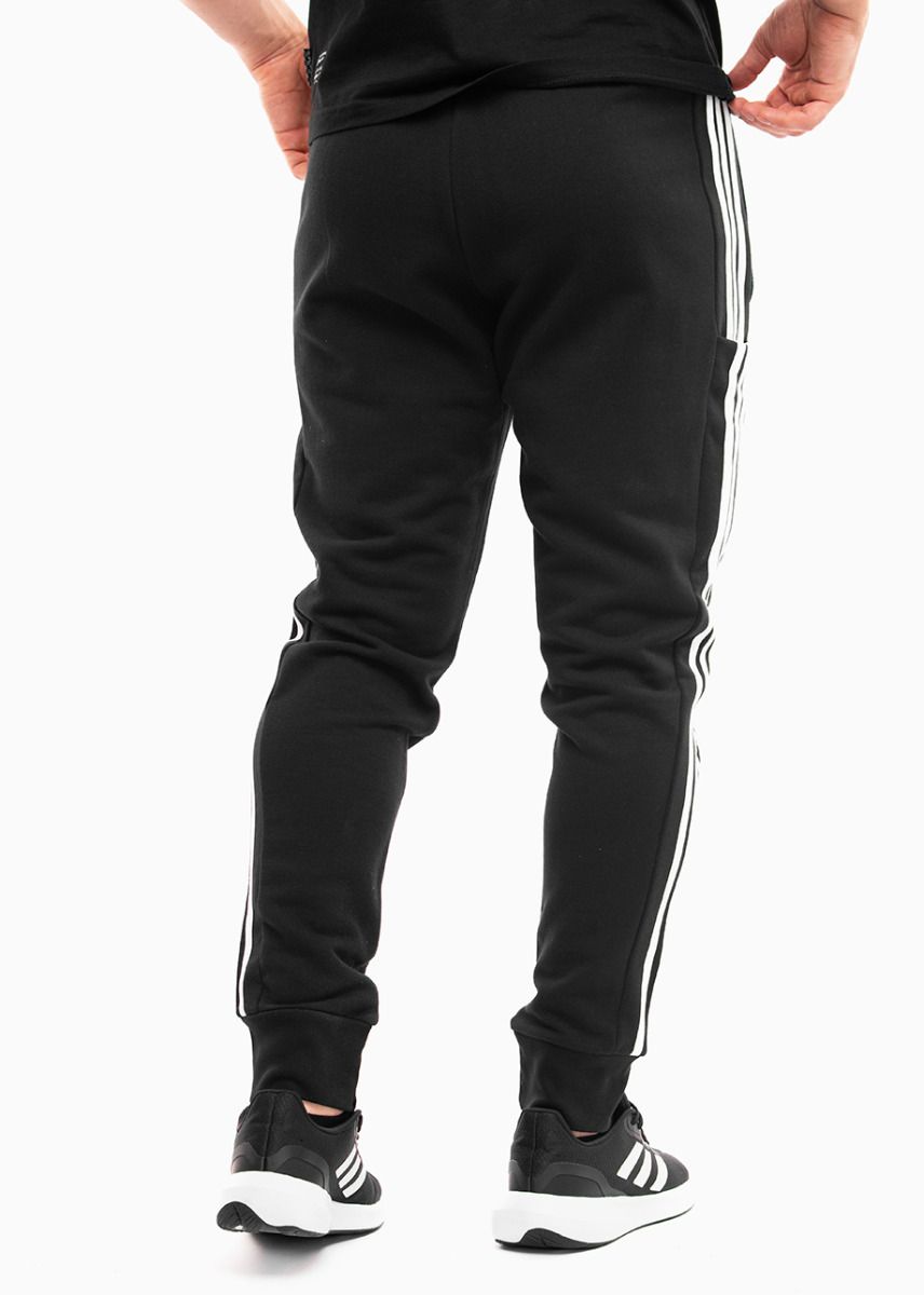 adidas Spodnie męskie Essentials French Terry Tapered Cuff 3-Stripes HA4337