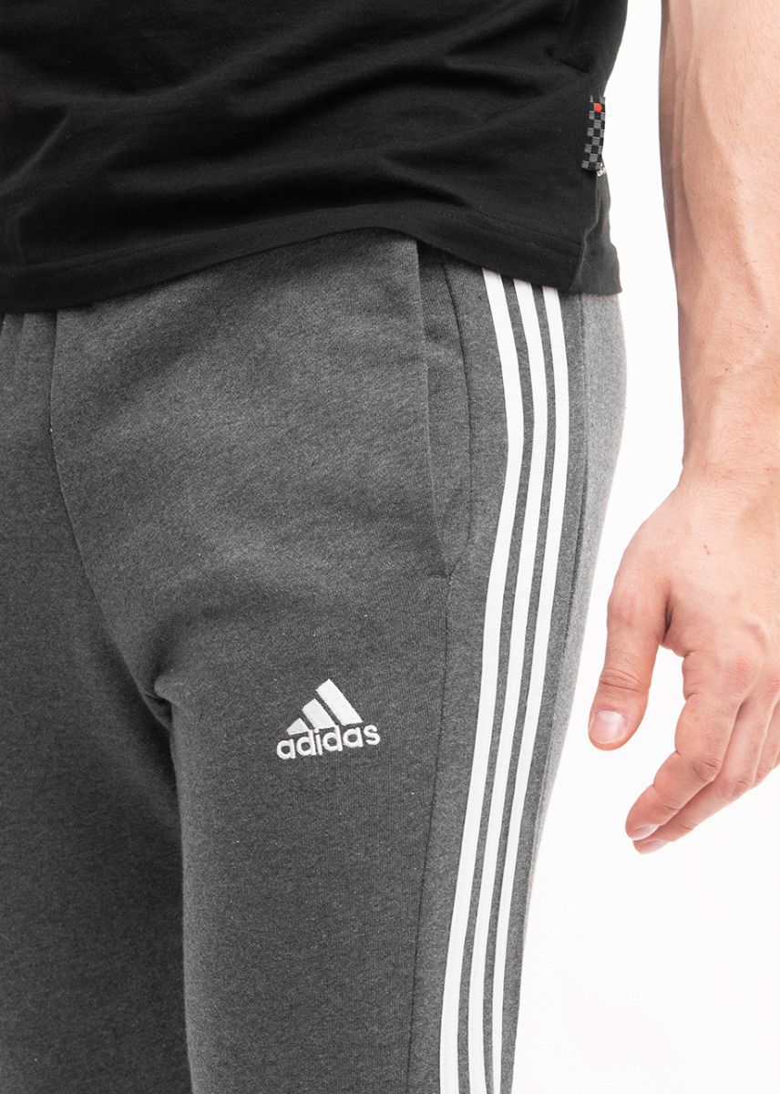 adidas Spodnie męskie Essentials French Terry Tapered Cuff 3-Stripes IC9408